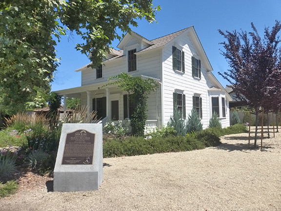 Photo of house and plaque